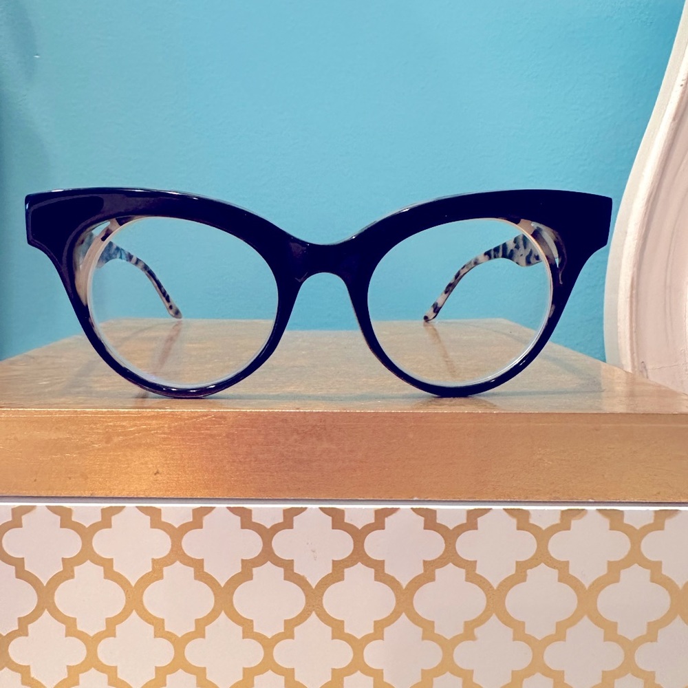 See eyewear black and leopard frames.